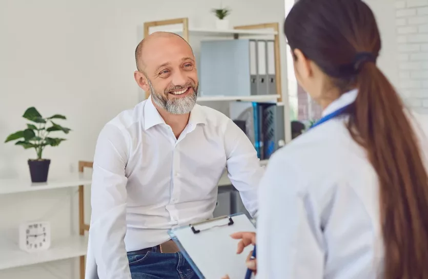 Doctor talking to middle aged man