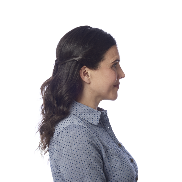 Side profile of middle aged woman wearing hearing aids