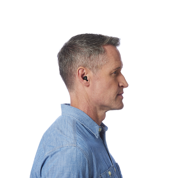 Side profile of middle aged man wearing hearing aids