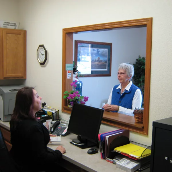 Receptionist speaking with patient