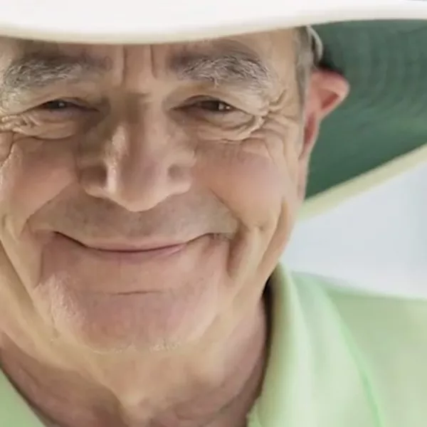 bill is smiling wearing his hearing aids