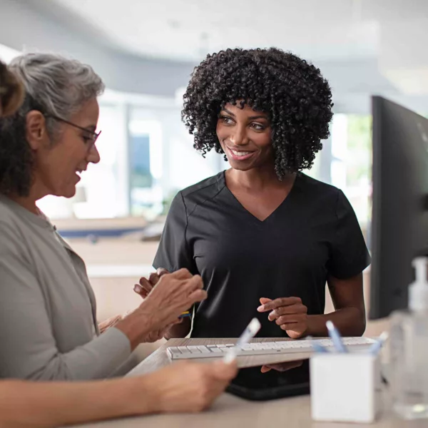 Patient discussing hearing aid options