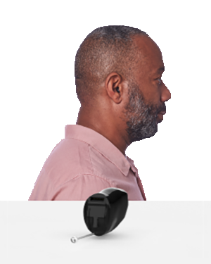 The side profile of a man wearing an Invisible IIC hearing aid