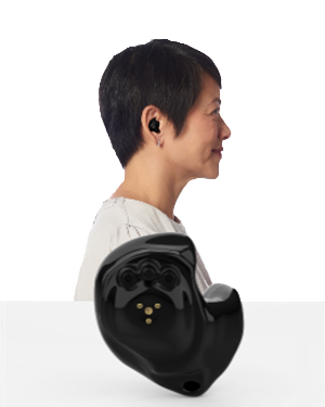 The side profile of a woman wearing an In-the-Ear ITE hearing aid