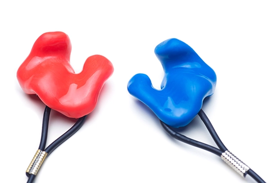 Earplugs custom molded to the left and right ear and used for hearing protection.