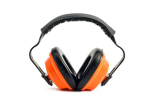Orange and black earmuffs used for hearing protection.